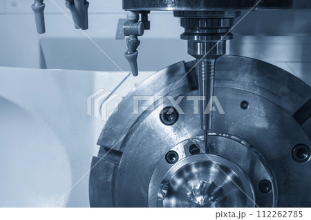 The 5-axis CNC milling machine cutting the automotive part with solid ball end mill tool in the light blue scene. The 5-axis CNC milling machine cutting the automotive part with solid ball end mill tool in the light blue scene. 112262785