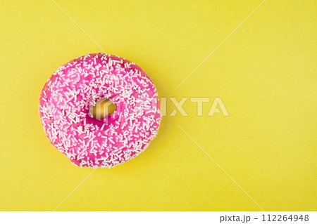 Pink donut on color background, flat lay, top view 112264948