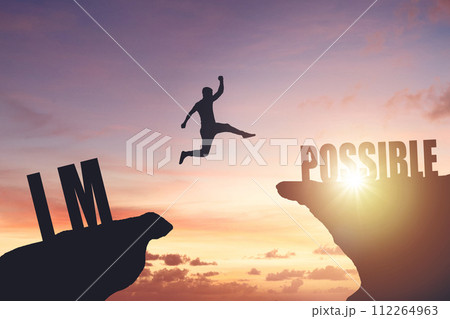 Silhouette of a man jumping from cliff to cliff, business and success concept Silhouette of a man jumping from cliff to cliff, business and success concept 112264963