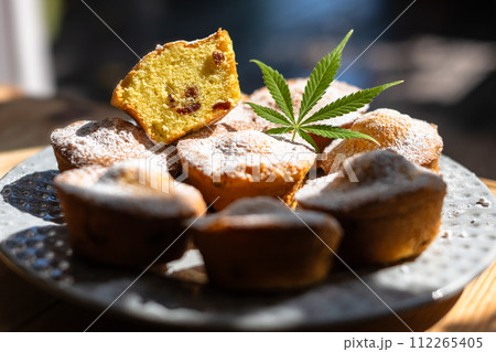 Cupcakes with cannabis leaf on plate Cupcakes with cannabis leaf on plate 112265405