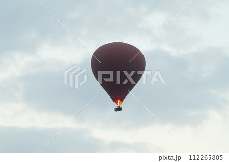 Balloons flying over Burmese temples of Bagan City from a balloon, unesco world heritage with forest trees, Myanmar or Burma. Tourist destination. 112265805