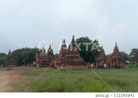 Burmese temples of Bagan City from a balloon, unesco world heritage with forest trees, Myanmar or Burma. Tourist destination. Burmese temples of Bagan City from a balloon, unesco world heritage with forest trees, Myanmar or Burma. Tourist destination. 112265841