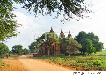 Burmese temples of Bagan City from a balloon, unesco world heritage with forest trees, Myanmar or Burma. Tourist destination. Burmese temples of Bagan City from a balloon, unesco world heritage with forest trees, Myanmar or Burma. Tourist destination. 112265846