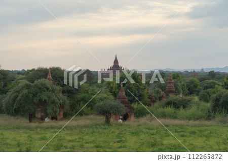 Burmese temples of Bagan City from a balloon, unesco world heritage with forest trees, Myanmar or Burma. Tourist destination. Burmese temples of Bagan City from a balloon, unesco world heritage with forest trees, Myanmar or Burma. Tourist destination. 112265872