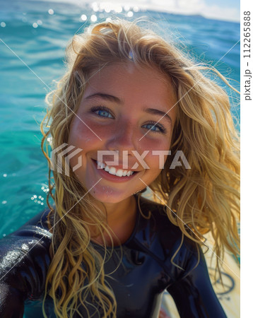 Woman athlete with surfboard among the waves on the beach, sport concept Woman athlete with surfboard among the waves on the beach, sport concept 112265888