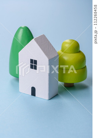A small wooden house and keys as an idea for investing in your own home 112268458
