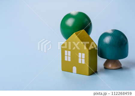 A small wooden house and keys as an idea for investing in your own home A small wooden house and keys as an idea for investing in your own home 112268459