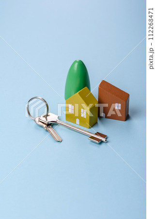 A small wooden house and keys as an idea for investing in your own home 112268471