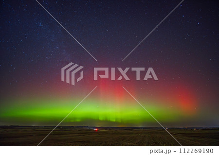 Northern lights - Aurora borealis dancing in the night sky. Northern lights - Aurora borealis dancing in the night sky. 112269190