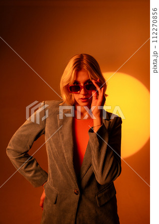 Fashionable portrait of blonde lady in sunglasses posing. Fashionable portrait of blonde lady in sunglasses posing. 112270856