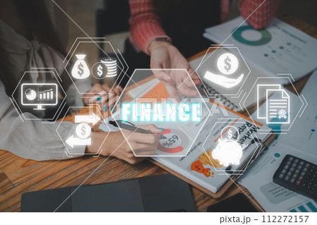 Finance concept, Business team analyzing income charts and graphs on office desk with finance icon on virtual screen. 112272157