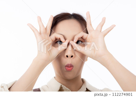 Joyful young asian woman wearing apron is barista attire gesturing OK with her hand. Joyful young asian woman wearing apron is barista attire gesturing OK with her hand. 112274901