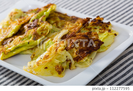 Cabbage leaves in batter is tasty vegan dish 112277595