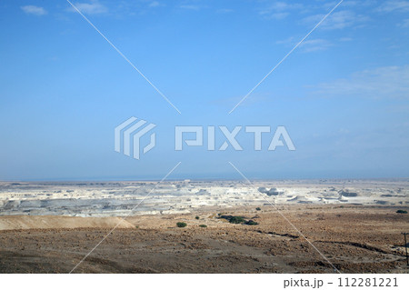 Waterless landscape of the Judea desert, view from Masada towards the Dead Sea, Israel Waterless landscape of the Judea desert, view from Masada towards the Dead Sea, Israel 112281221