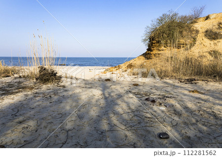 View of the beautiful landscape with the beach and sand dunes, the landscape of the coast. View of the beautiful landscape with the beach and sand dunes, the landscape of the coast. 112281562