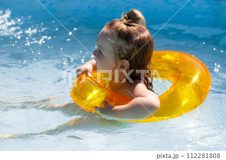 Baby girl swimming in a pool. Water park. Summer Baby girl swimming in a pool. Water park. Summer 112281808