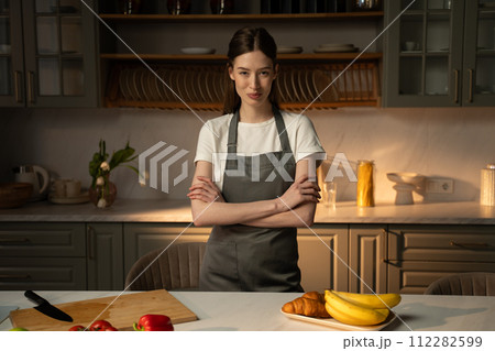 Confident Home Chef Stands Proudly In Modern Kitchen During Early Morning 112282599