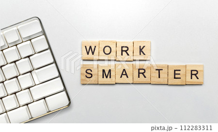 The row of wooden cubes with 'work smarter' text 112283311