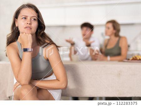 Woman mother and young guy during family quarrel accuse adult daughter 112283375