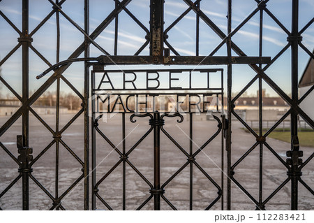 DACHAU, GERMANY Work sets you free sign on gates at Dachau Concentration Camp DACHAU, GERMANY Work sets you free sign on gates at Dachau Concentration Camp 112283421