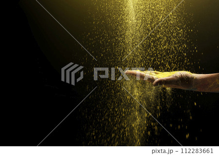 Human hand with colorful Holi powder 112283661