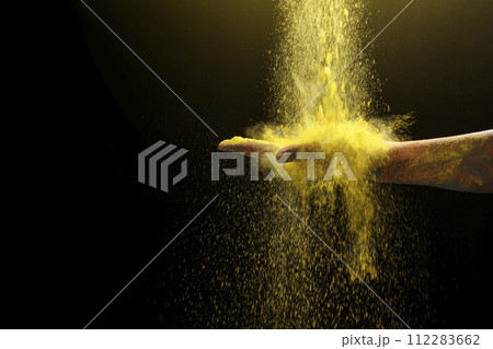 Human hand with colorful Holi powder 112283662