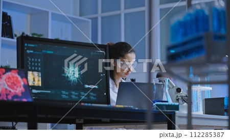 Bacteriology lab scientist working on research, using modern computer technology Bacteriology lab scientist working on research, using modern computer technology 112285387
