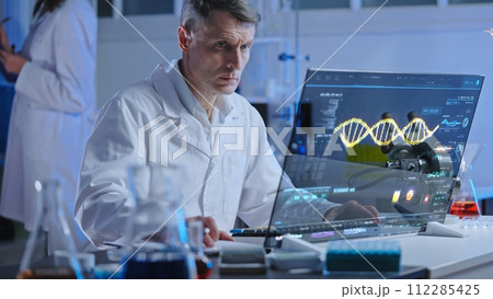 DNA lab scientist studying human genome structure on holographic screen, medical research 112285425