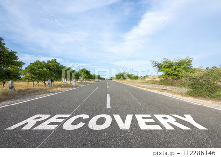'Recovery' text on the asphalt road 'Recovery' text on the asphalt road 112286146