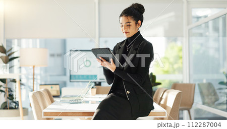 Happy woman in office with tablet, email or social media review for tech business, schedule or agenda. Smile, digital app and businesswoman networking online for market research, website and report. 112287004