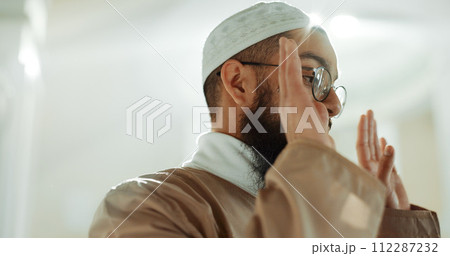 Islamic prayer, faith and man in mosque with gratitude, mindfulness and love for God or Allah. Worship, religion and Muslim imam praying for hope in holy temple praise, spiritual teaching and peace. 112287232