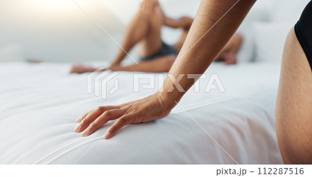 Couple, bed and hands on duvet for love, romance or intimacy in affection, morning or seduction at home. Closeup of woman and man or lovers lying in bedroom for compassion, anniversary or date Couple, bed and hands on duvet for love, romance or intimacy in affection, morning or seduction at home. Closeup of woman and man or lovers lying in bedroom for compassion, anniversary or date 112287516