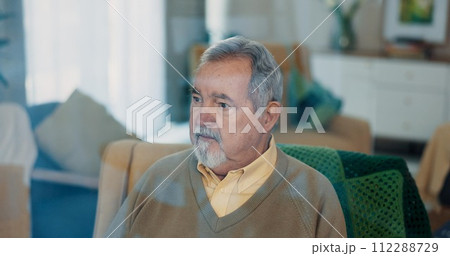 Thinking, dreaming and senior man on chair, living room and retirement home. Old, pondering and elderly male person with memories, remember and contemplating in lounge for dementia or Alzheimers 112288729