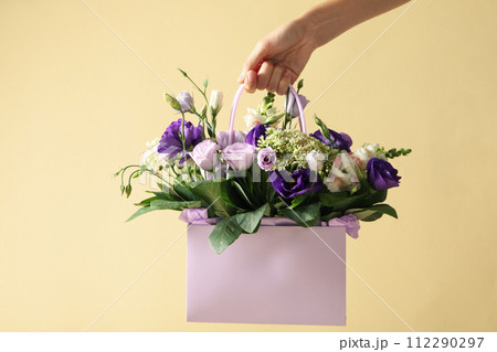 Beautiful, fresh flowers in a gift bag. Beautiful, fresh flowers in a gift bag. 112290297