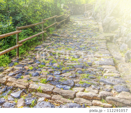 Old stone road on soft sunlight with copy space 112291057