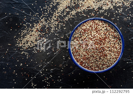 Quinoa mix. Mixed white, red and black quinoa seeds in a bowl Quinoa mix. Mixed white, red and black quinoa seeds in a bowl 112292795