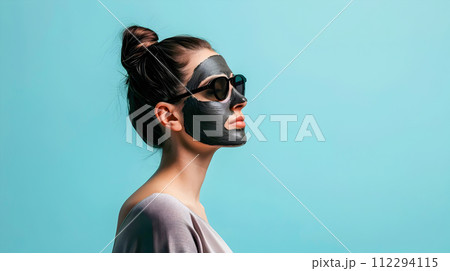 Elegant Young Woman in Black Face Mask with Sunglasses 112294115