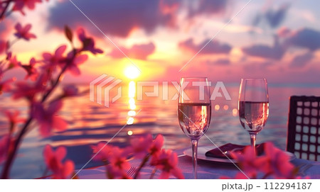 Beach Dining Set with Wine and Flowers at Sunset Beach Dining Set with Wine and Flowers at Sunset 112294187