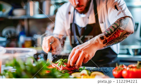 Chef Preparing Vegetables in a Commercial Kitchen 112294221