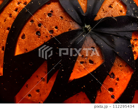 Hyperrealistic dark Halloween pumpkin. Extreme closeup. Duotone 112295434