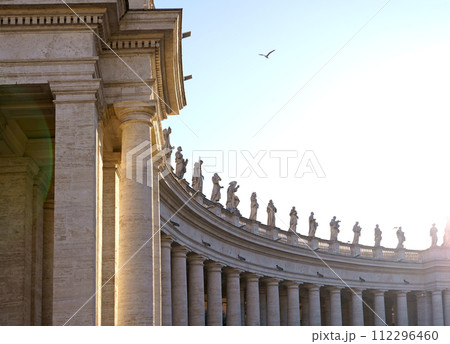 Italy. Rome. Vatican. St. Peter's Square. December 2023. View of the colonnade with statues of saints surrounding St. Peter's Square Italy. Rome. Vatican. St. Peter's Square. December 2023. View of the colonnade with statues of saints surrounding St. Peter's Square 112296460