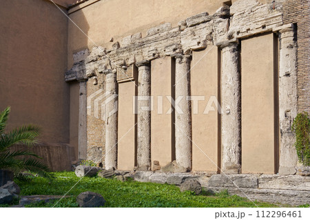 Italy. Rome. Modern city and ruins, ruins of an empire. A textured wall showing how Roman columns are built into a modern city Italy. Rome. Modern city and ruins, ruins of an empire. A textured wall showing how Roman columns are built into a modern city 112296461
