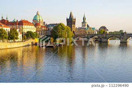 Prague - Charles bridge, Czech Republic. September 2023. Scenic aerial sunset on the architecture of the Old Town Pier and Charles Bridge over the Vltava River in Prague, Czech Republic. Prague - Charles bridge, Czech Republic. September 2023. Scenic aerial sunset on the architecture of the Old Town Pier and Charles Bridge over the Vltava River in Prague, Czech Republic. 112296490