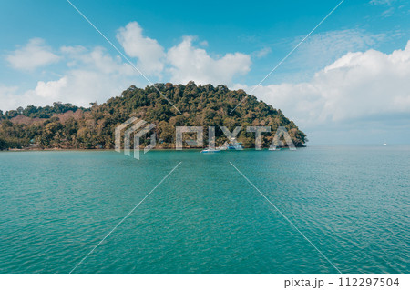 fishing village,Colorful fishing boats bob gently in a calm harbor, ready for their next adventure at sea 112297504