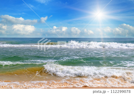 tropical beach and sun on blue sky . 112299078