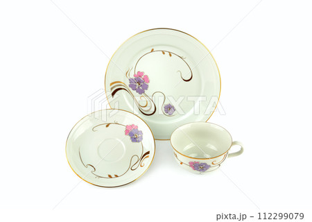 Porcelain vintage cup saucer and plate isolated on white. Vintage Bavarian teaware. 112299079