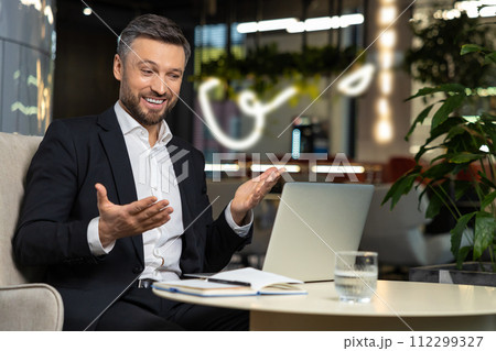 Elegant businessman working and looking excited 112299327
