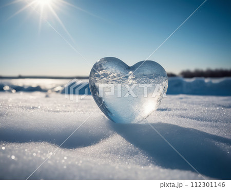 Piece of ice in the shape of a heart illuminated by rays of sunlight Piece of ice in the shape of a heart illuminated by rays of sunlight 112301146