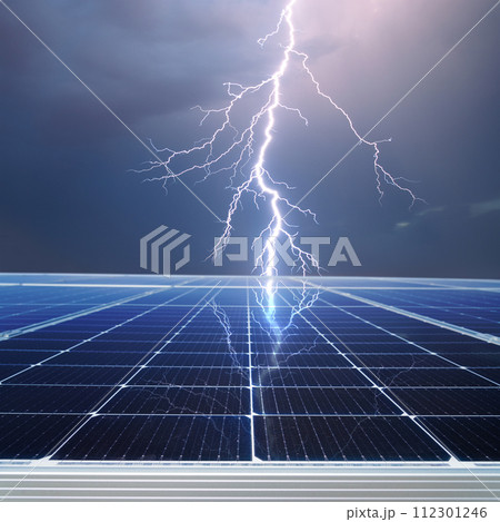 Solar panel and stormy cloudy sky with thunder and lightning reflection - concept of sustainable and renewable sources. 112301246