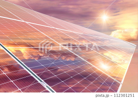 Photo collage of sunset and solar panel, photovoltaic, alternative electricity source - concept of sustainable resources Photo collage of sunset and solar panel, photovoltaic, alternative electricity source - concept of sustainable resources 112301251